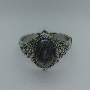 Beautiful silver toned bracelet with rose